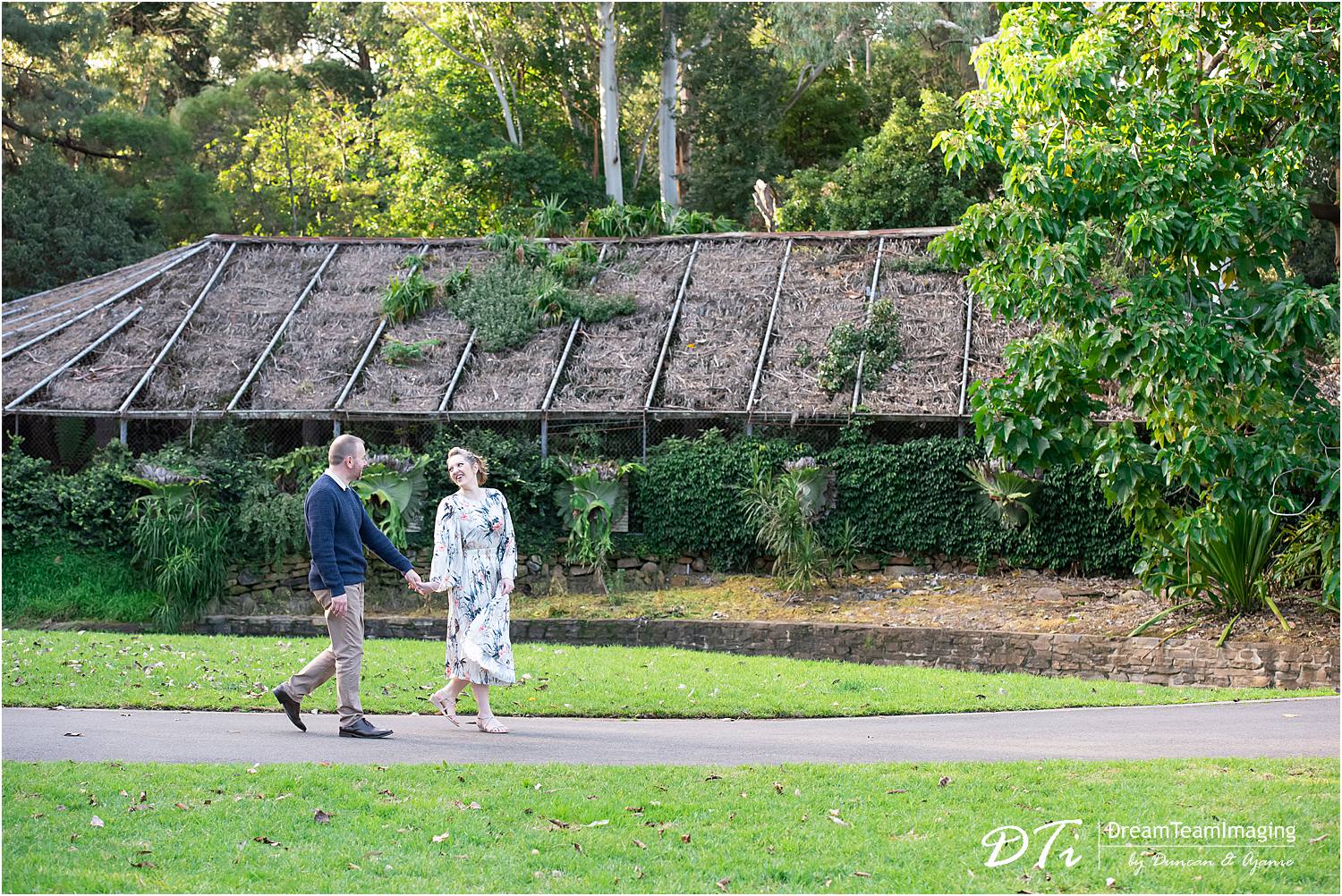 Couple engagement session at Botanic Gardens Adelaide, couple hugging and walking