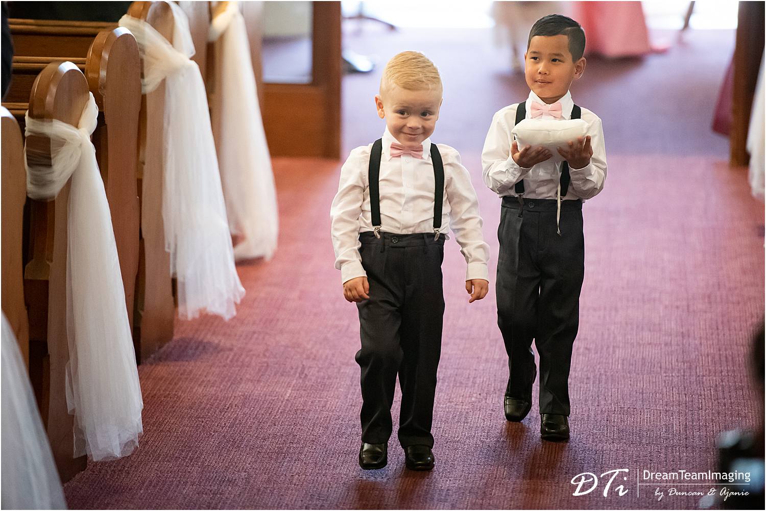 page Boys walking down the aisle at St Andrews by the Sea Uniting Church Glenelg