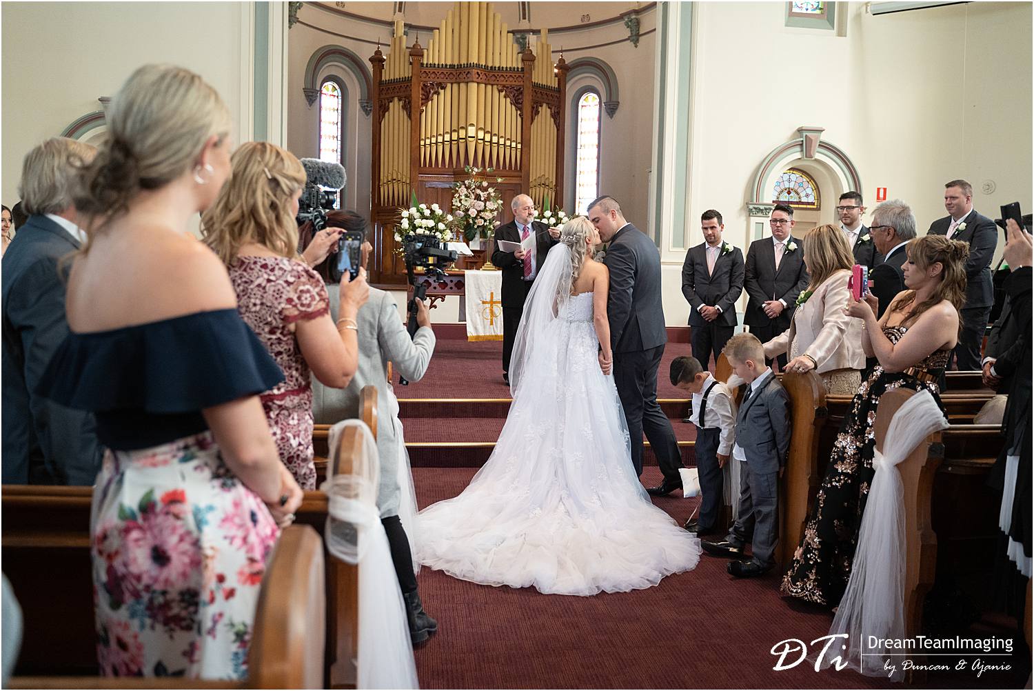 Bride walking up the aisle St Andrews by the Sea Uniting Church Glenelg